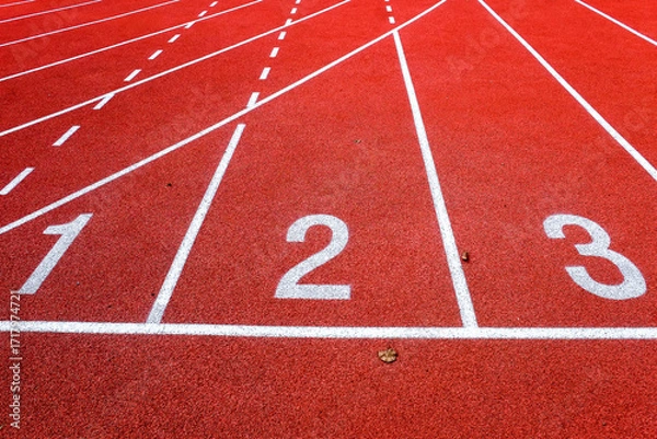 Fototapeta Running track with numbers in the stadium, sport background.