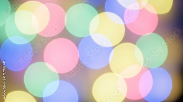 Fototapeta Softly blurred bokeh lights in pastel colors creating a festive and dreamy atmosphere