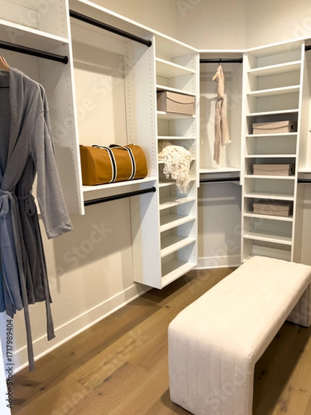 Fototapeta Walk-In Closet with Open Shelving and Bench