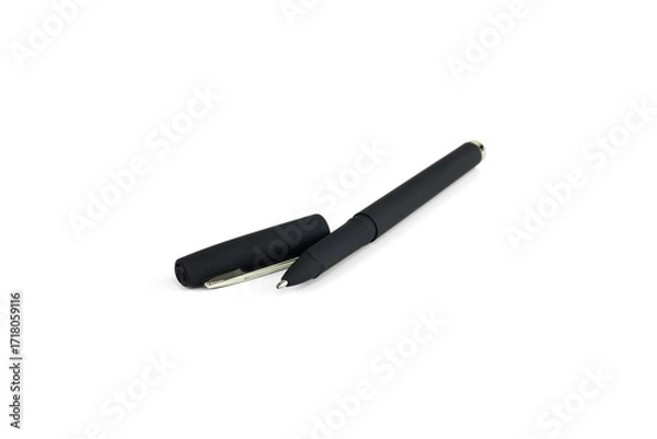 Fototapeta Black ballpoint pen with detached cap isolated on white background with clipping path.