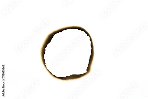 Fototapeta Burnt round hole on paper with dark edges isolated on white background with clipping path.