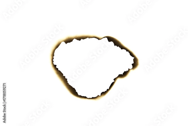 Fototapeta Burnt irregular hole in paper with dark edges isolated on white background with clipping path.