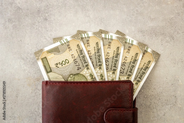 Fototapeta India money. Indian rupees, 500-rupee bills sticking out of a wallet. The currency is INR. Business and financial concept.