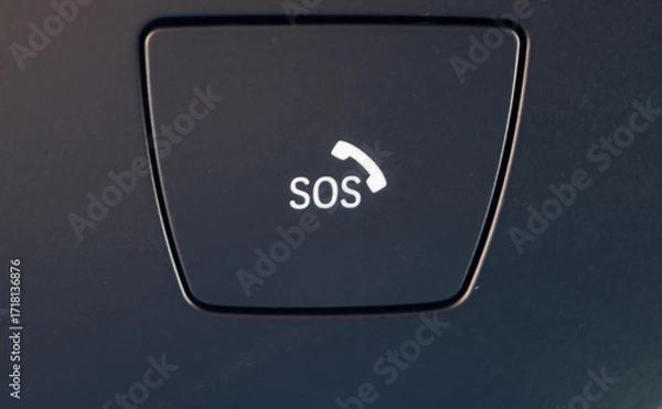 Fototapeta SOS button in overhead panel of modern car with phone symbol, close-up of vehicle technology
