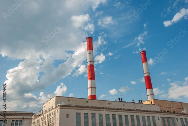 Obraz Factory with Red and White Chimneys in Moscow Against Blue Sky