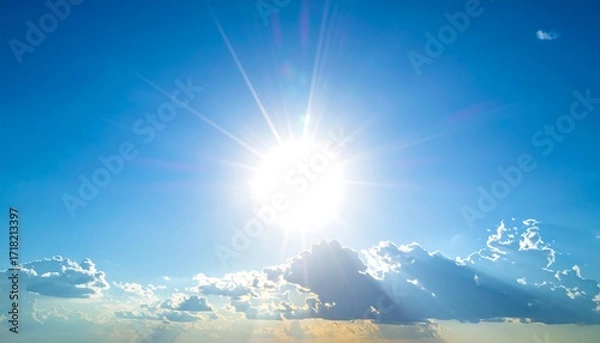 Fototapeta Bright sun shining through fluffy clouds