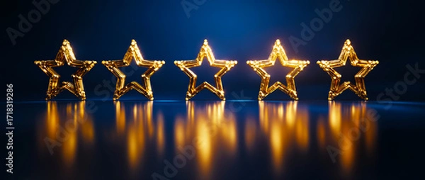 Obraz Five golden stars in a row,  glowing on a dark blue background.