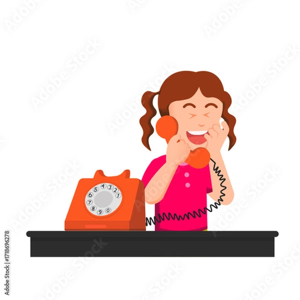 Fototapeta A little girl laughing while talking on a retro phone