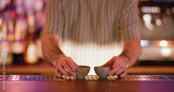 Fototapeta Sake cup. Serving alcoholic drink. Barkeeper putting on counter little empty clay bowls for traditional asian beverage. Ceramic dishes for rice wine.