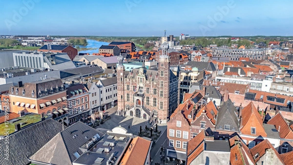 Fototapeta Venlo city center aerial skyline view from above, historic townhall, buildings architecture and Meuse river, Venlo town drone cityscape, the Netherlands