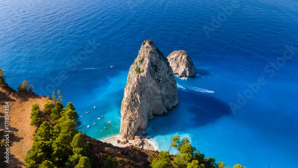Fototapeta Myzithres Zakynthos Greece aerial view with twin limestone rocks turquoise shallow bay golden sand beach and deep blue Ionian Sea in sunlight