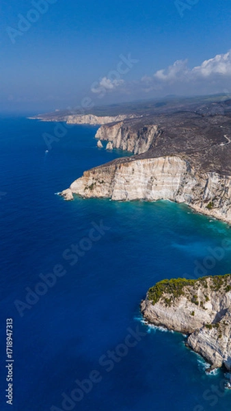 Fototapeta Plakaki beach Zakynthos Greece aerial view of dramatic white cliffs turquoise Ionian Sea deep blue horizon and rugged coastline stretching afar