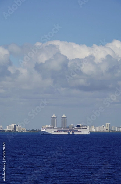 Fototapeta Italian family cruiseships cruise ship liners Armonia and Fortuna with Miami Beach, Florida skyline ready for Caribbean summer cruising