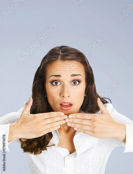 Fototapeta Wow! Expressive surprised, astonished shocked businesswoman wear white shirt. Amazed corporate business woman, isolated on grey gray background. Vertical banner image with free text space