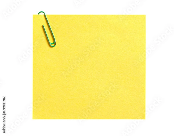 Fototapeta Blank yellow sticky note with a green paperclip