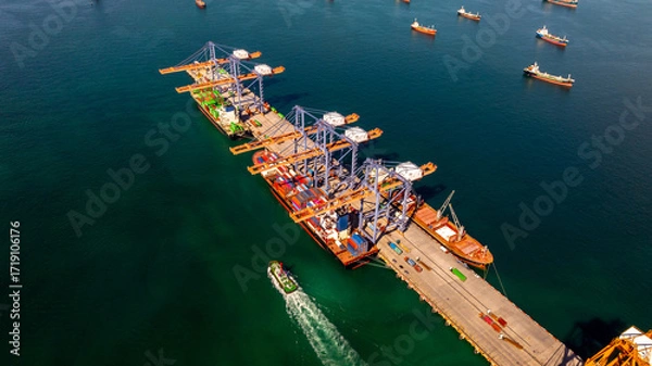 Fototapeta Aerial view container cargo ship international port terminal with gantry crane, Global business import export logistic maritime transport by container cargo ship vessel, Container ship cargo freight.