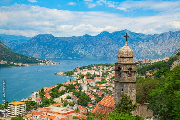Fototapeta Scenic view of the Bay of Kotor in Montenegro with an old church tower in the foreground.
