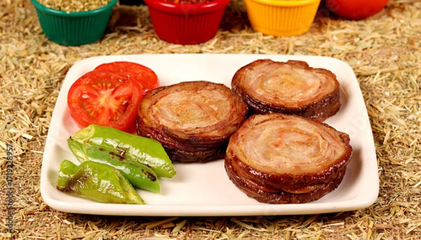 Obraz 3 kokorech on a white plate, cut into one portion