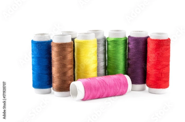 Obraz Colored sewing threads on white.