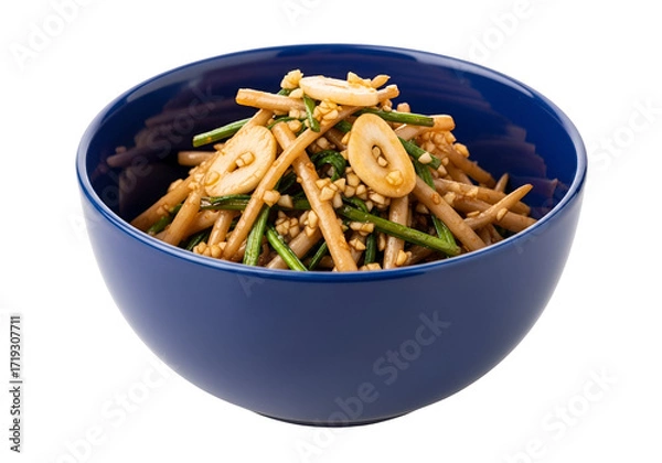 Fototapeta A vibrant salad of thin, light-brown vegetable strips, dressed in a savory sauce, garnished with toasted garlic cloves and sesame seeds, presented in a deep blue bowl against a black background.