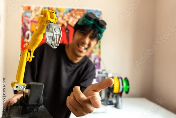Fototapeta 3D printing and robotics drive modern manufacturing, showcasing engineers, designers, and technicians developing prototypes, automation systems, and innovative digital solutions.