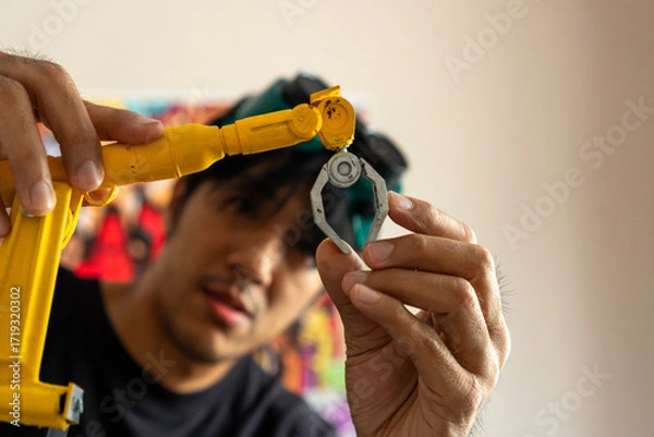 Fototapeta 3D printing and robotics drive modern manufacturing, showcasing engineers, designers, and technicians developing prototypes, automation systems, and innovative digital solutions.