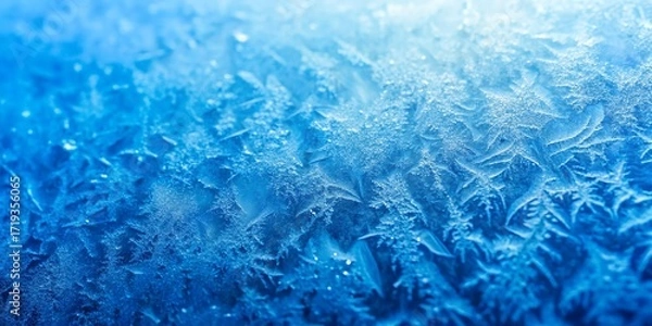 Fototapeta Abstract blue frosty ice patterns on glass with light background
