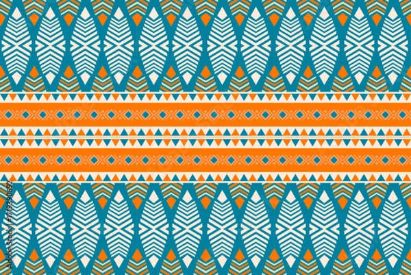 Fototapeta Colorful geometric ethnic seamless pattern with traditional tribal ornaments in orange, teal, and white. Perfect for textile design, fabric prints, wallpapers, and decorative backgrounds.