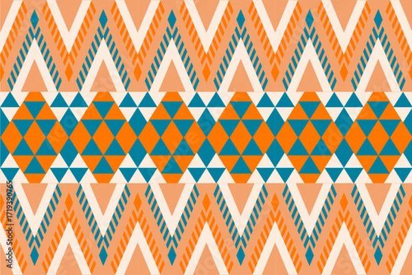 Fototapeta Colorful geometric ethnic seamless pattern with traditional tribal ornaments in orange, teal, and white. Perfect for textile design, fabric prints, wallpapers, and decorative backgrounds.