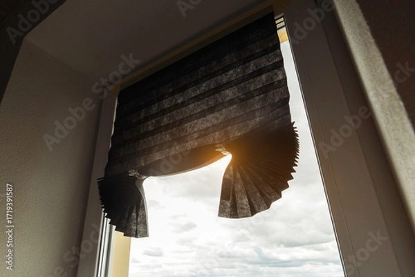 Fototapeta Temporary pleated paper blinds on window with sunlight, affordable window covering solution for privacy, comfort and home interior decoration.