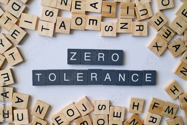 Fototapeta Zero Tolerance words in wooden cube blocks, strict policy concept, rules and discipline idea, law enforcement and regulation theme
