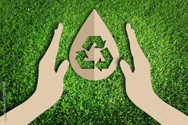 Fototapeta  Save water concept. Paper cut of eco on green grass.