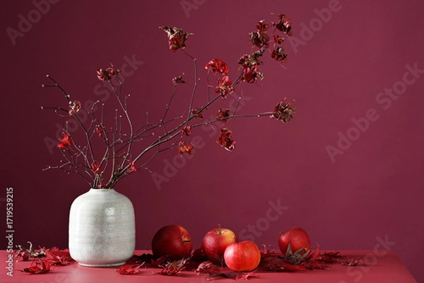 Fototapeta Autumnal decoration of maple branches and red apples
