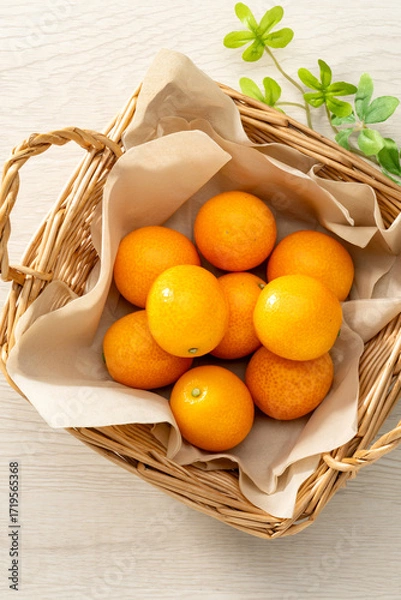 Fototapeta 新鮮な金柑と木目の背景