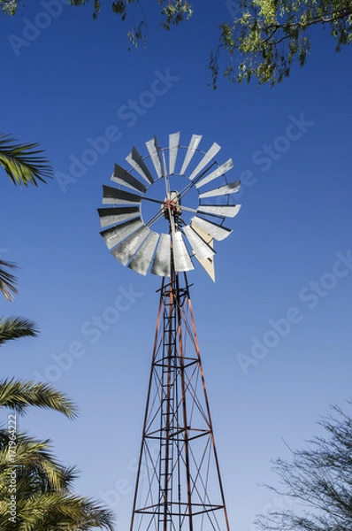 Obraz Pinwheel / Old windmill, alternative energy generation by wind energy.