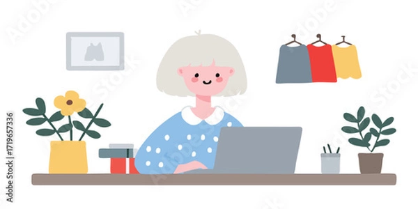 Fototapeta A stylish woman is seated at a desk, engrossed in work on her laptop, with a room for creativity and work. A picture of a shirt, plants in pots and clothes hanging are arranged on the desk. 