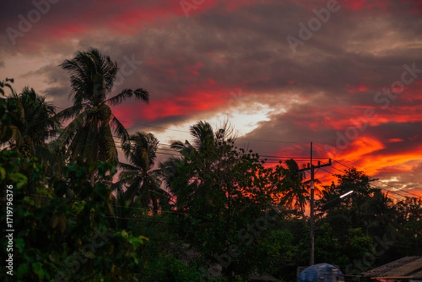 Fototapeta The background of the twilight sunset, the sky has beautiful changes, amidst the green fields and various trees, there is a cool breeze blowing throughout the journey to the viewpoint.