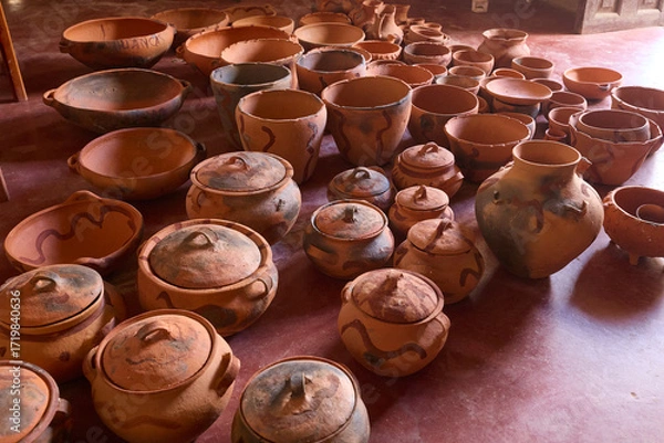 Fototapeta Still warm from the fire, the freshly fired pottery of Huancas emerges from the kiln — glowing with earthy tones, strength, and the mark of ancestral tradition