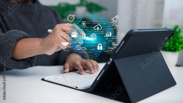 Fototapeta Person using stylus on tablet with digital globe, business technology, global networking, digital transformation