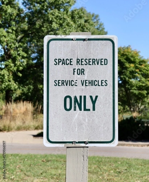 Fototapeta A close view on the space reserved for service vehicle sign.
