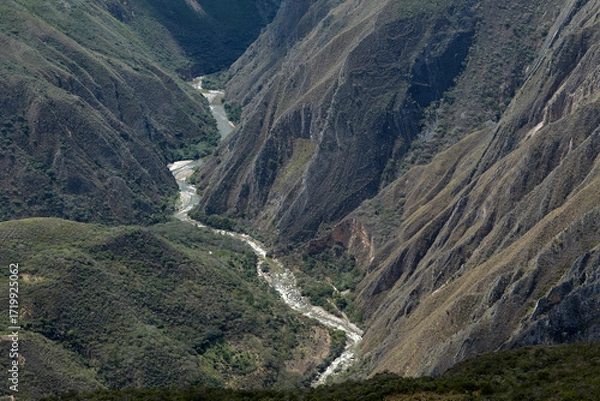 Fototapeta From the Mirador de Huancas, the Sonche Canyon reveals its breathtaking depth and immensity. Sheer cliffs plunge into the valley below, while the vast Andean landscape stretches beyond
