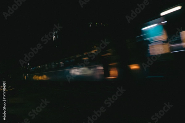 Obraz Blurred Night Train Moving Through City