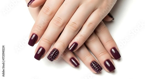 Fototapeta Elegant dark red manicure with glitter accents on white background