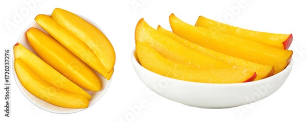 Fototapeta mango slices in ceramic bowl isolated on white background. Top view. Flat lay