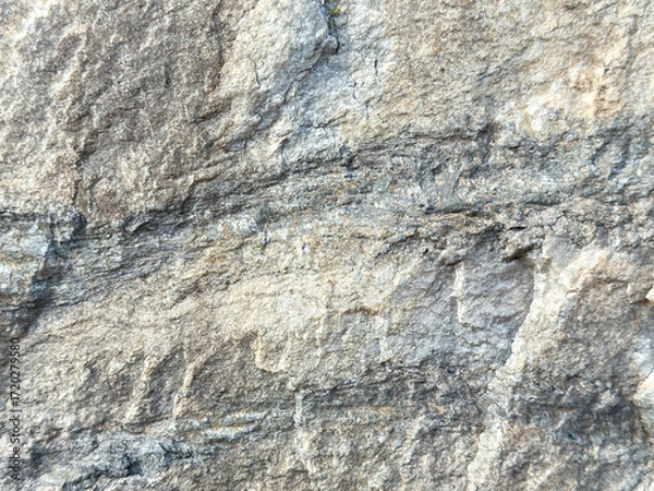 Fototapeta Close-up of natural rock surface with textured patterns