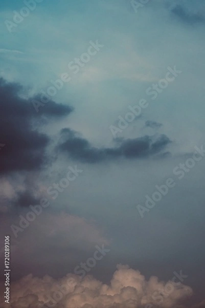 Obraz Storm horizon with glowing pastel light above clouds