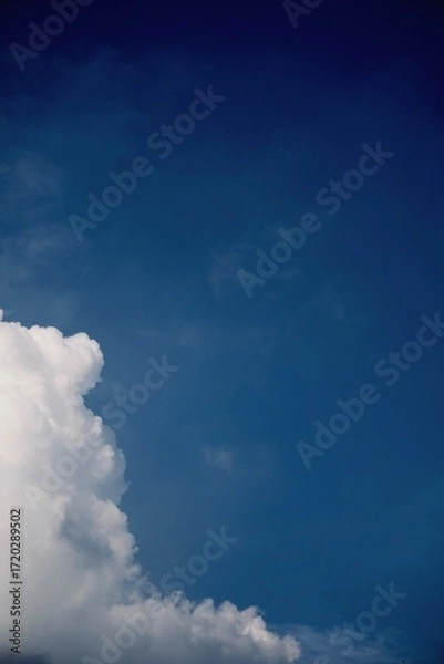 Fototapeta cloud at the left side with a blue sky