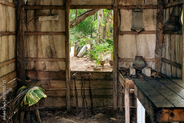 Obraz Rustic doorway with a view into a lush green garden and natural light streaming.