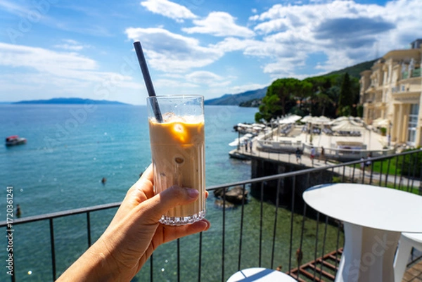Fototapeta drinking iced caffee on a rooftop bar in opatija croatia