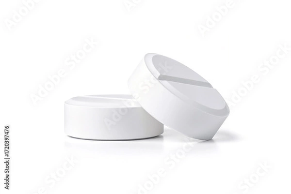 Fototapeta Two large round pills isolated on white background